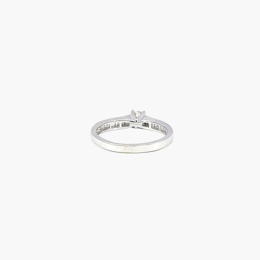 Silver ring with a diamond on a white background
