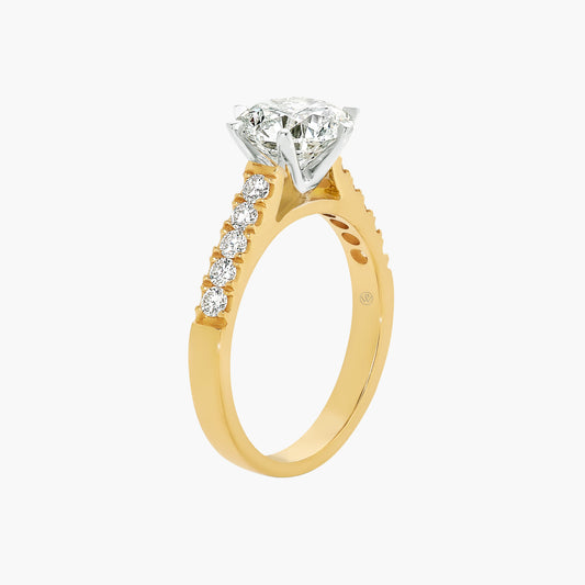 Gold ring with a diamond on a white background