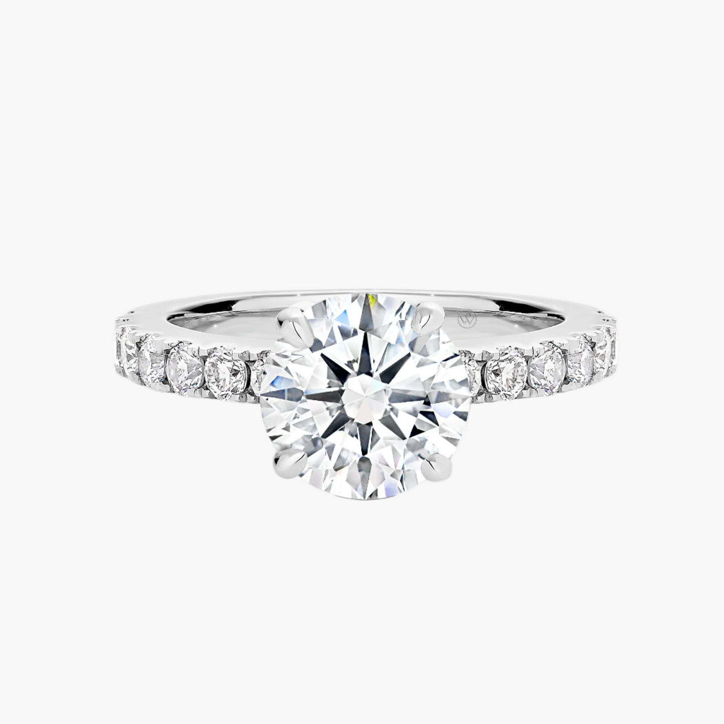 Diamond ring with a central large diamond and smaller diamonds on the band against a white background