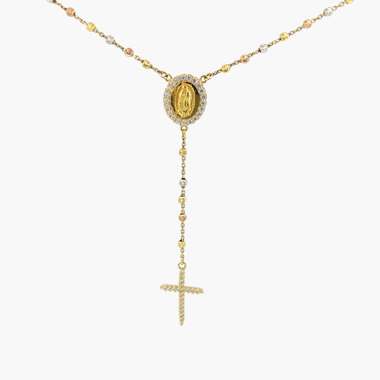 Gold necklace with a pendant and cross on a white background