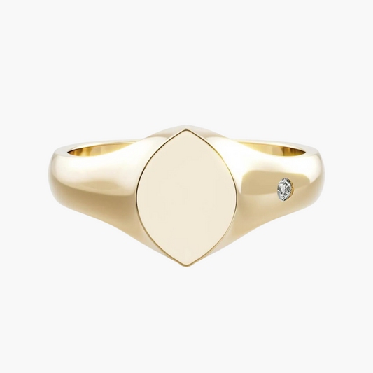 Gold ring with a diamond on a white background