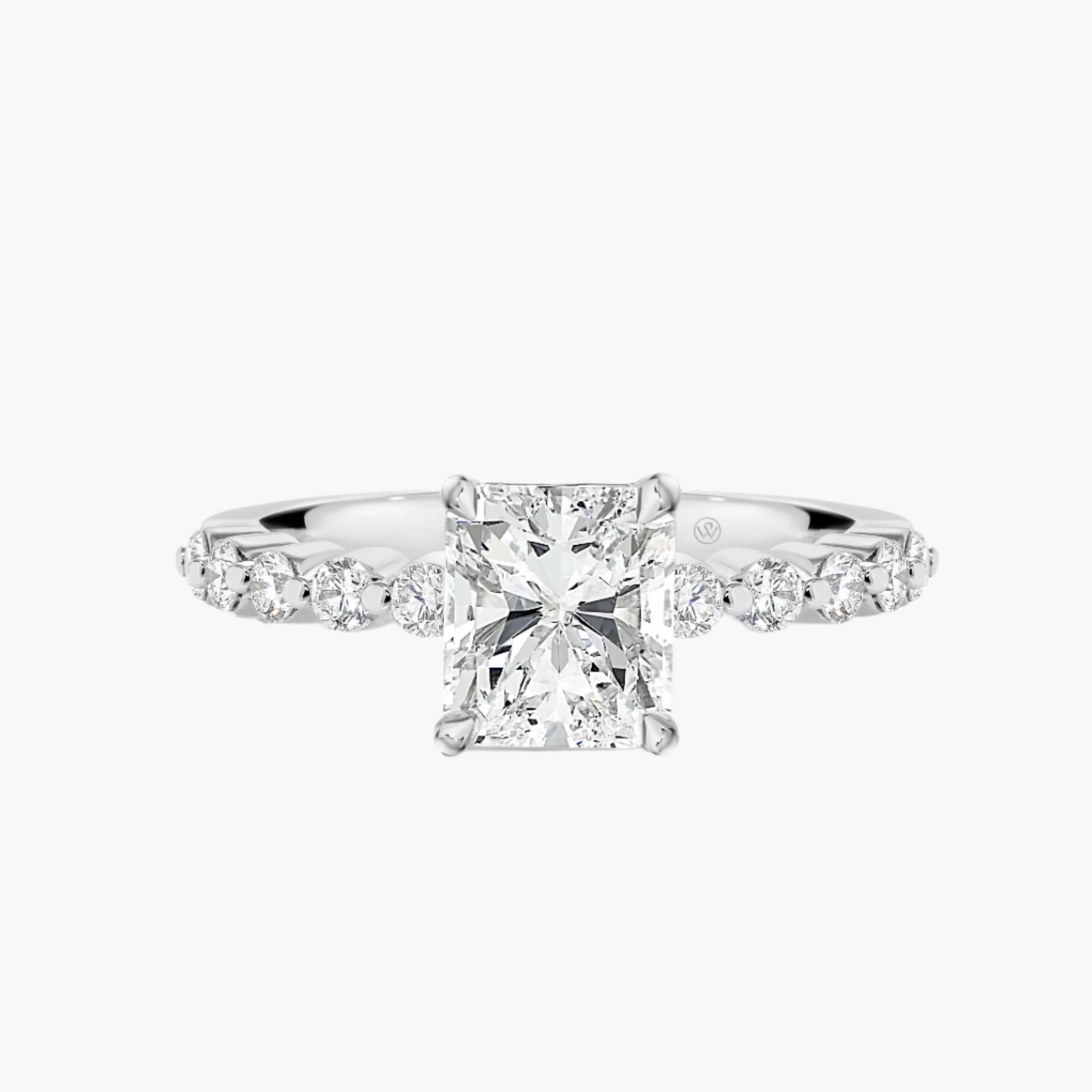 Diamond ring with a central gemstone and smaller diamonds on a white background