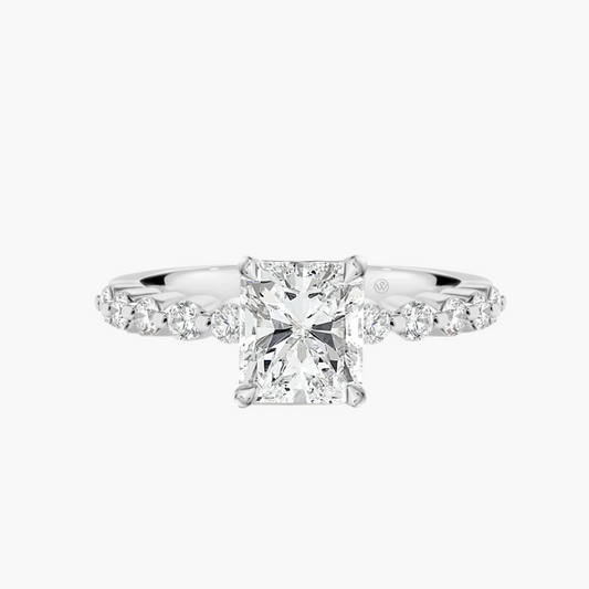 Diamond ring with a central gemstone and smaller diamonds on a white background