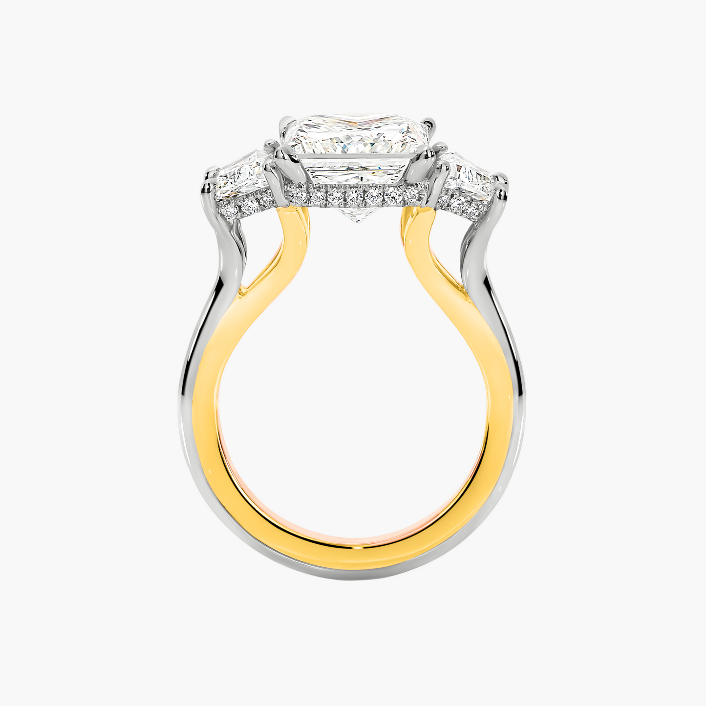 Two-tone gold and silver ring with diamond accents on a white background