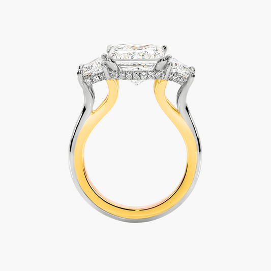 Two-tone gold and silver ring with diamond accents on a white background