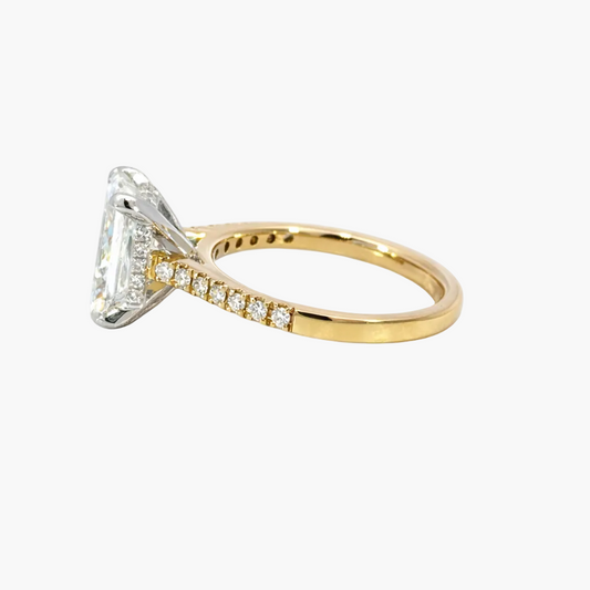 Gold ring with a diamond on a white background
