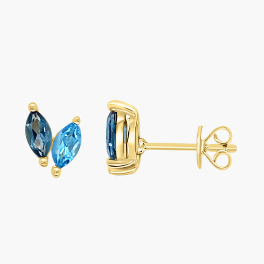 Gold earrings with blue gemstones on a white background