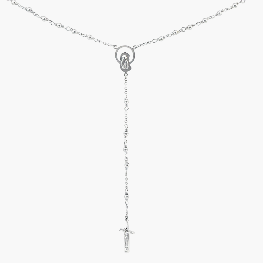 Silver necklace with a cross pendant on a white background