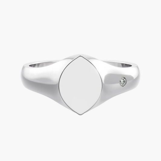 Silver signet ring with a diamond on a white background
