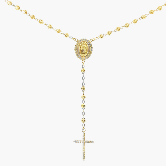 Gold rosary necklace with a central pendant on a white background