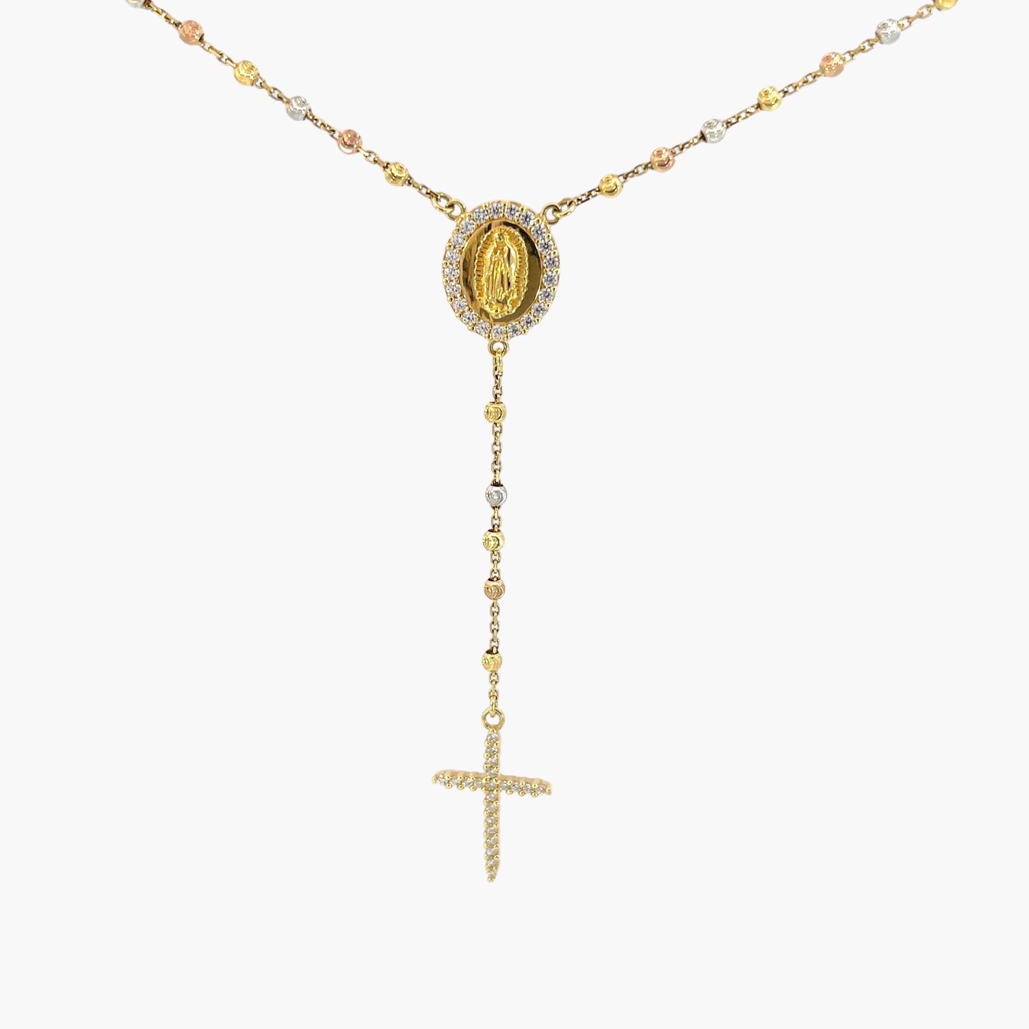 Gold necklace with a pendant and cross on a white background