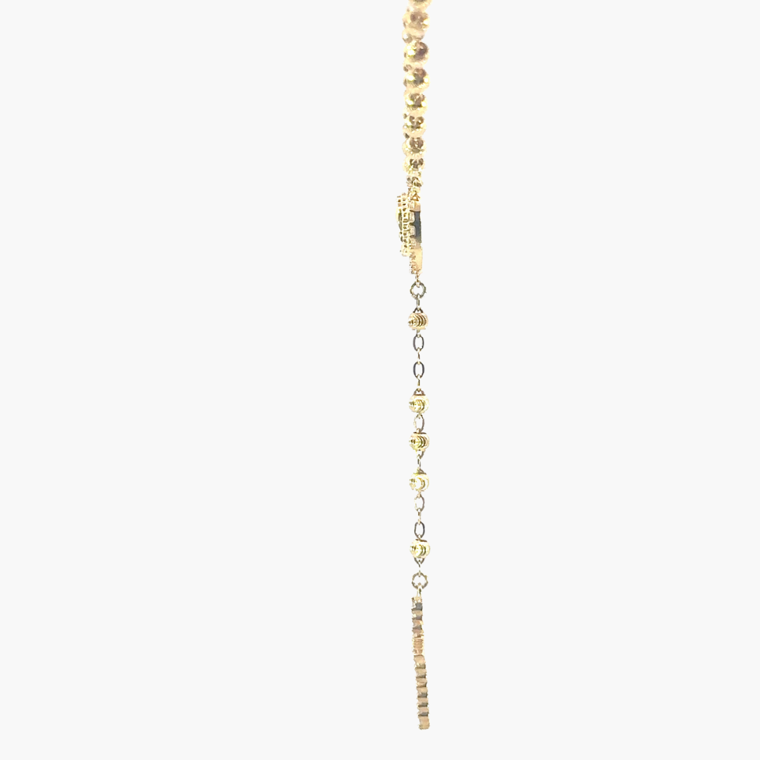Gold necklace with heart-shaped beads on a white background