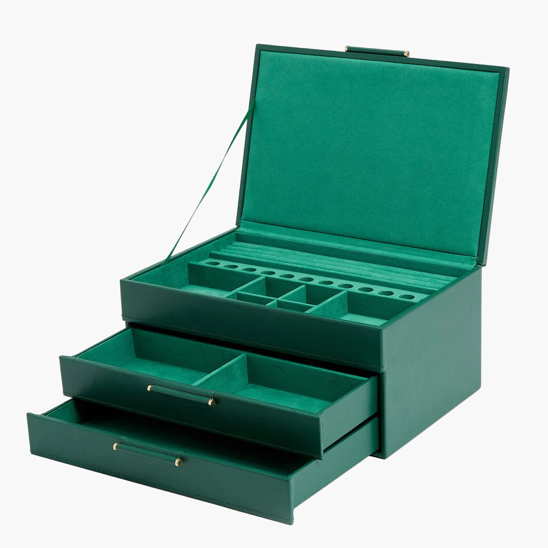 Green jewelry box with multiple compartments on a white background