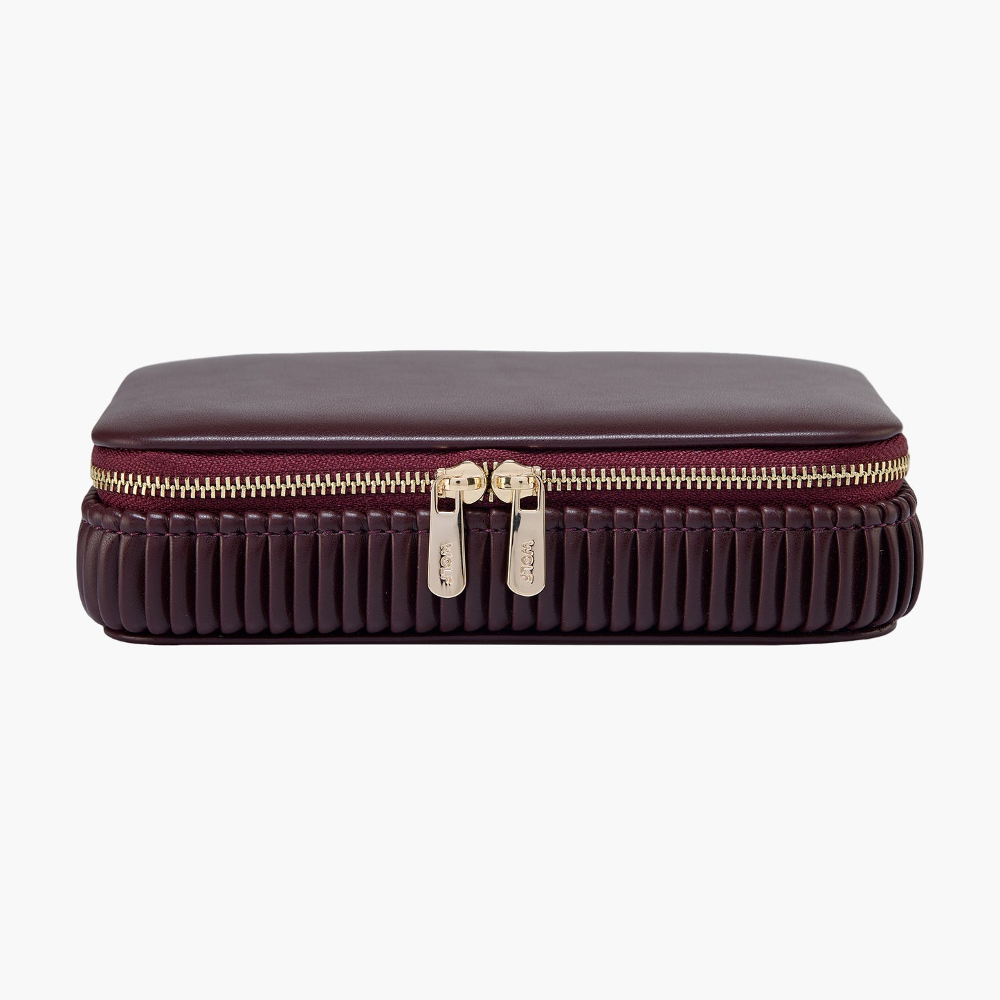 Brown travel case with gold zipper on a white background