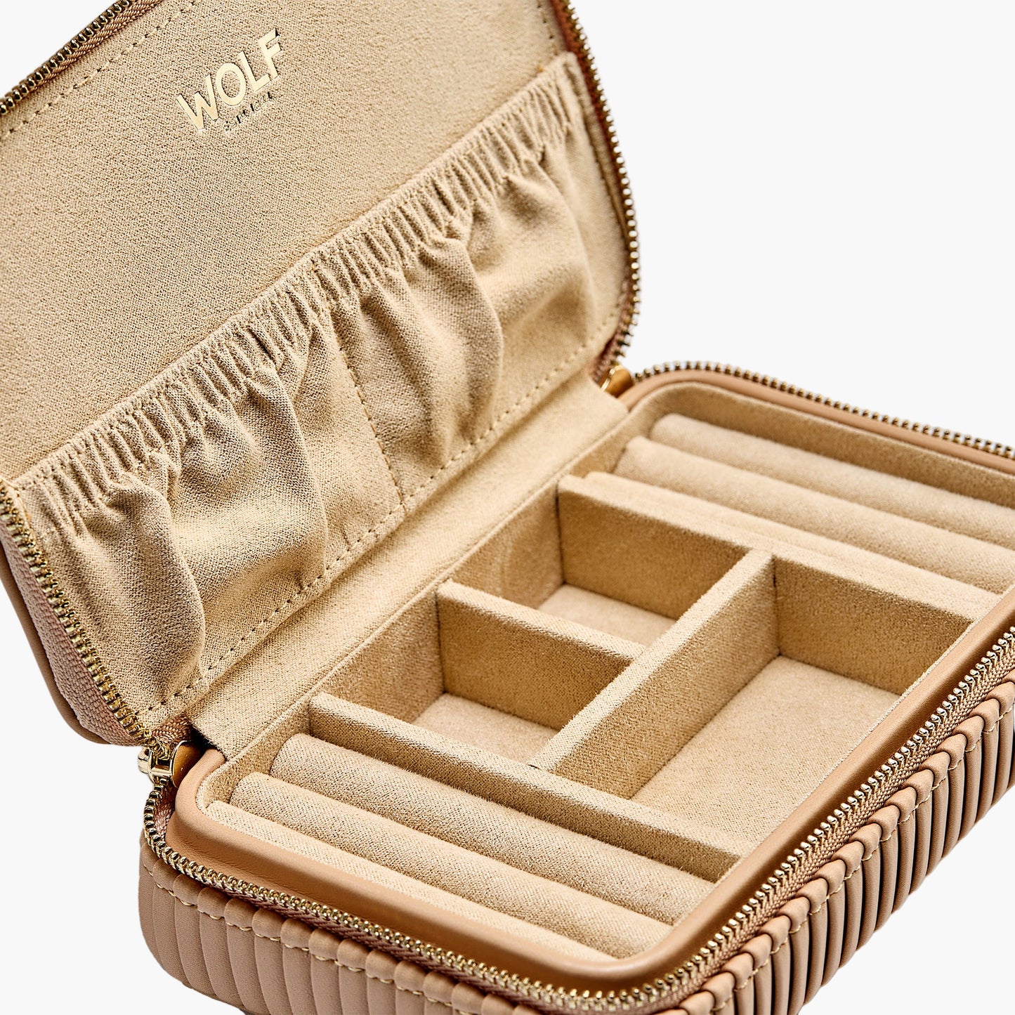 Beige jewelry case with compartments and 'WOLF' branding on a white background
