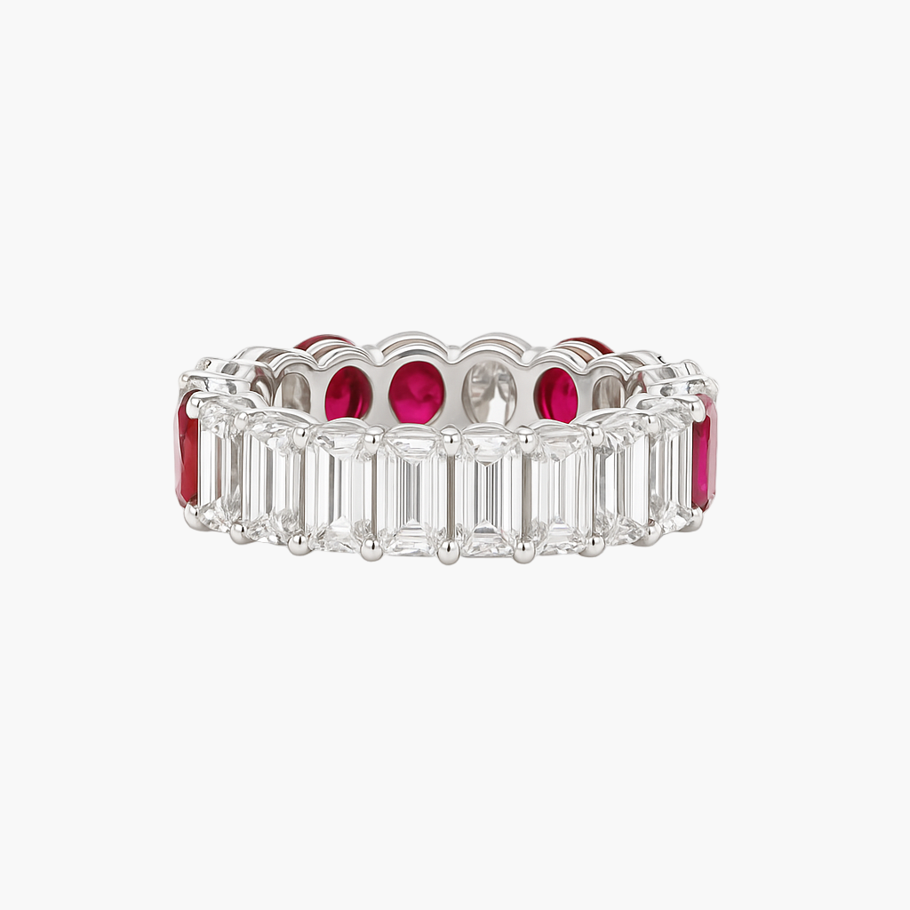 Eternity ring with emerald-cut diamonds and rubies on a white background
