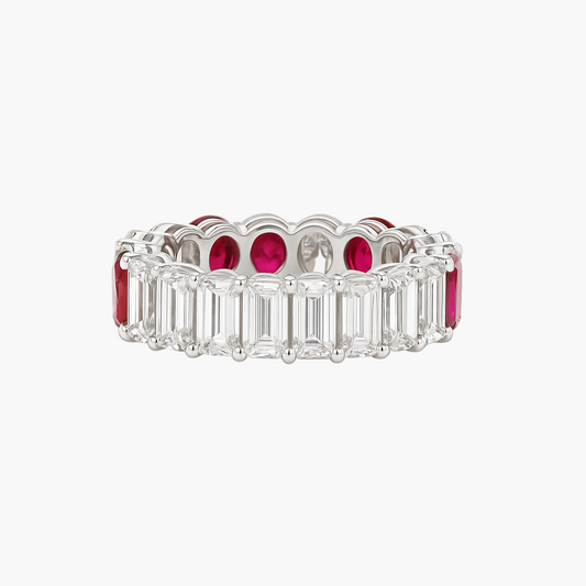 Eternity ring with emerald-cut diamonds and rubies on a white background