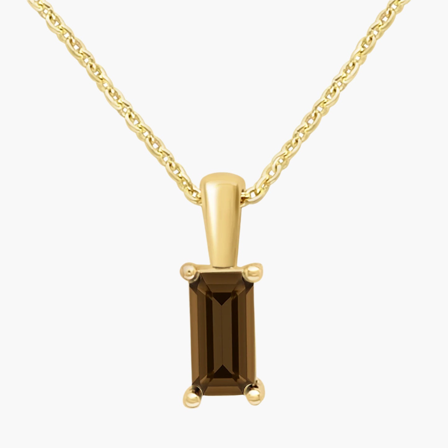 Gold pendant with a brown gemstone on a white background