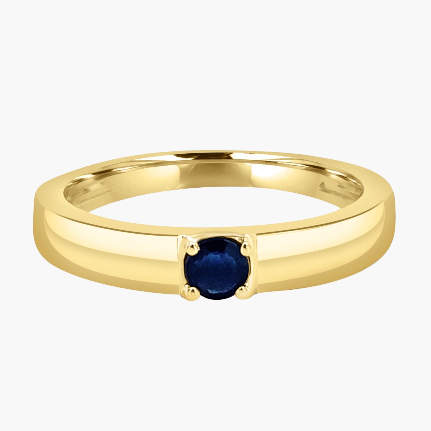 Gold ring with a blue gemstone on a white background