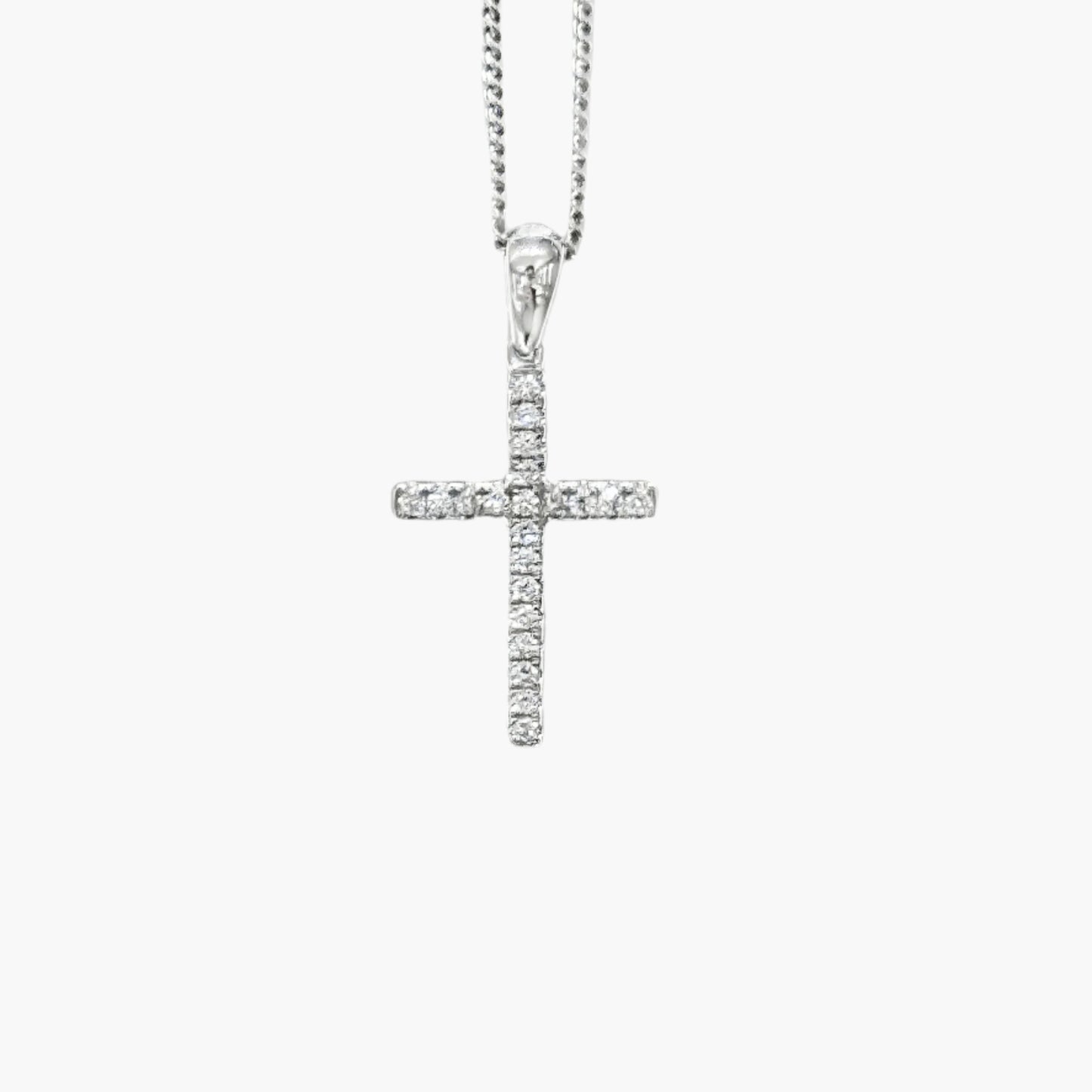 Silver cross pendant necklace on a white background