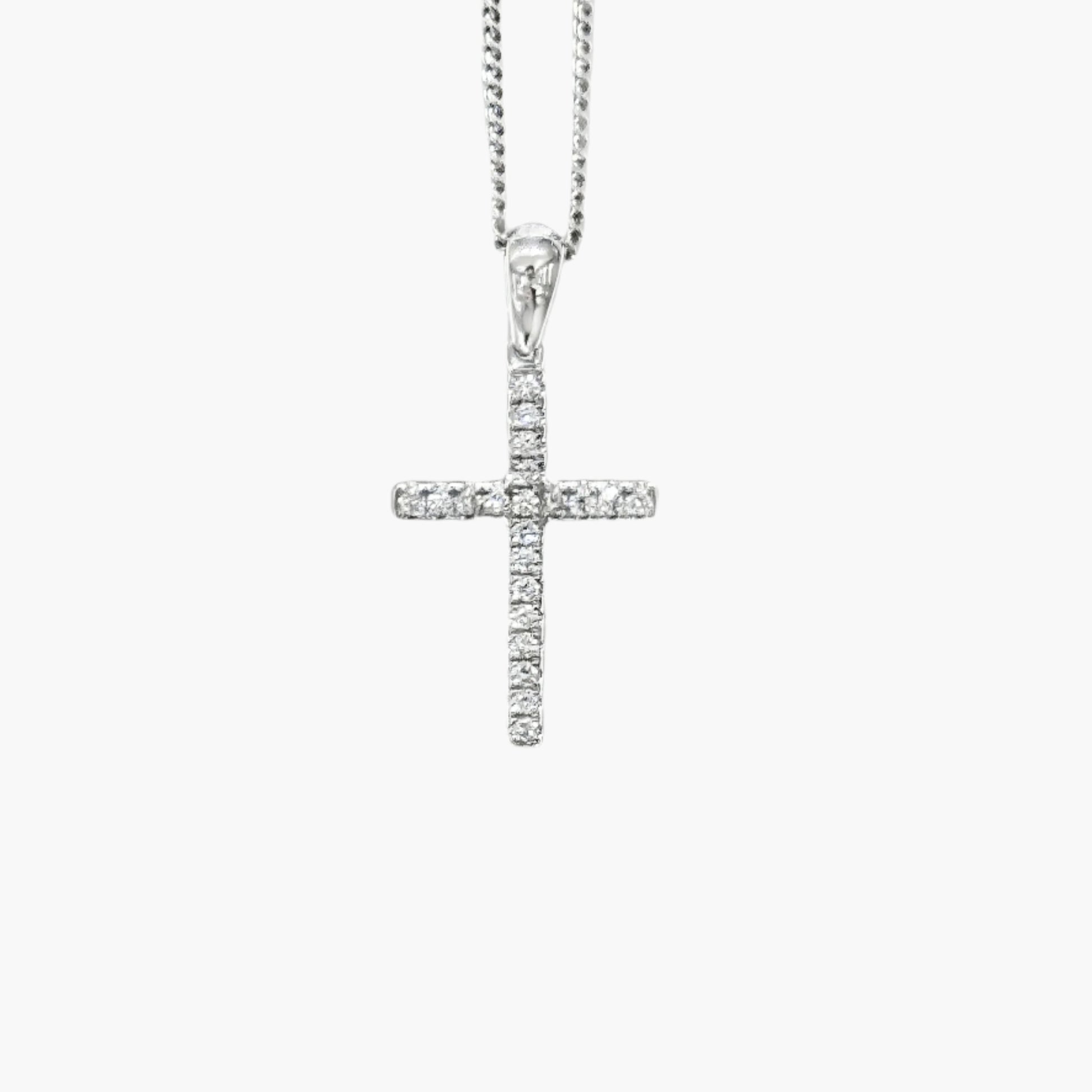 Silver cross pendant necklace on a white background