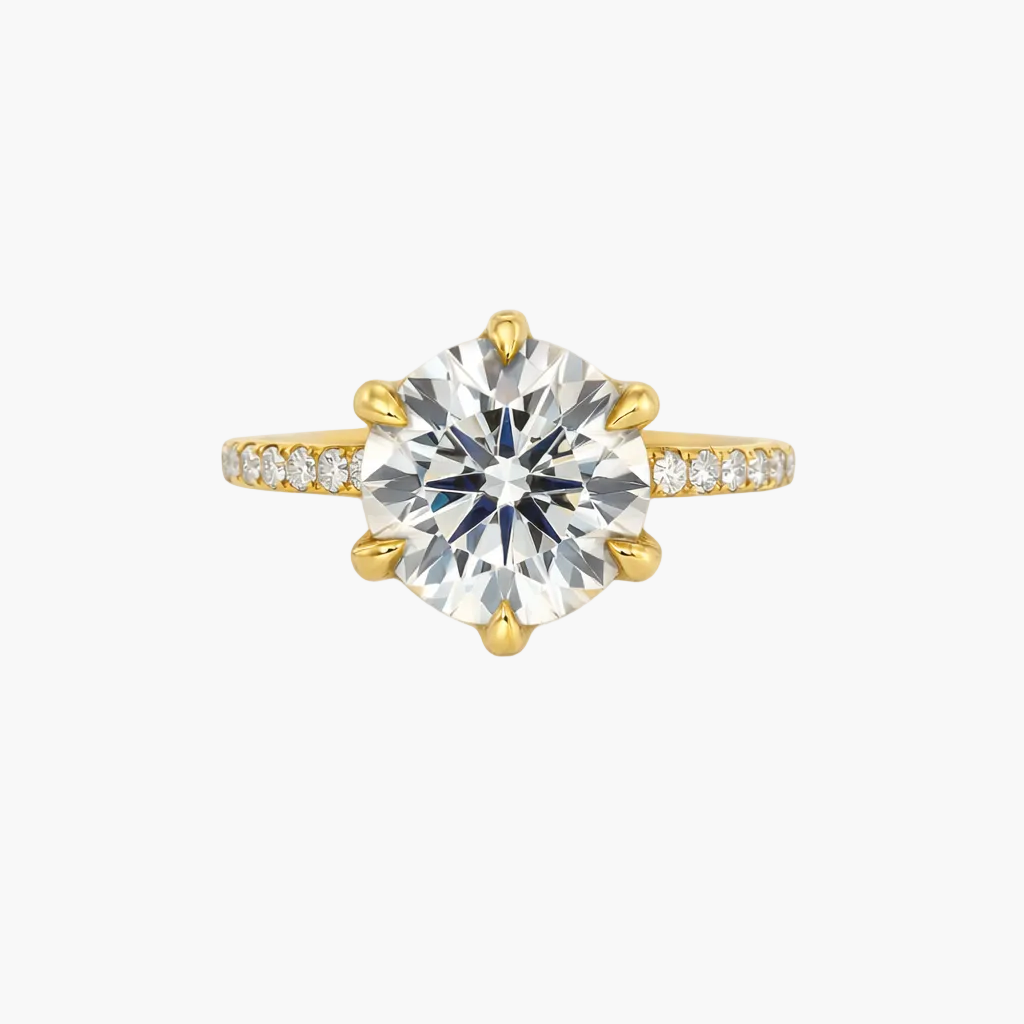 Gold ring with a large diamond on a white background