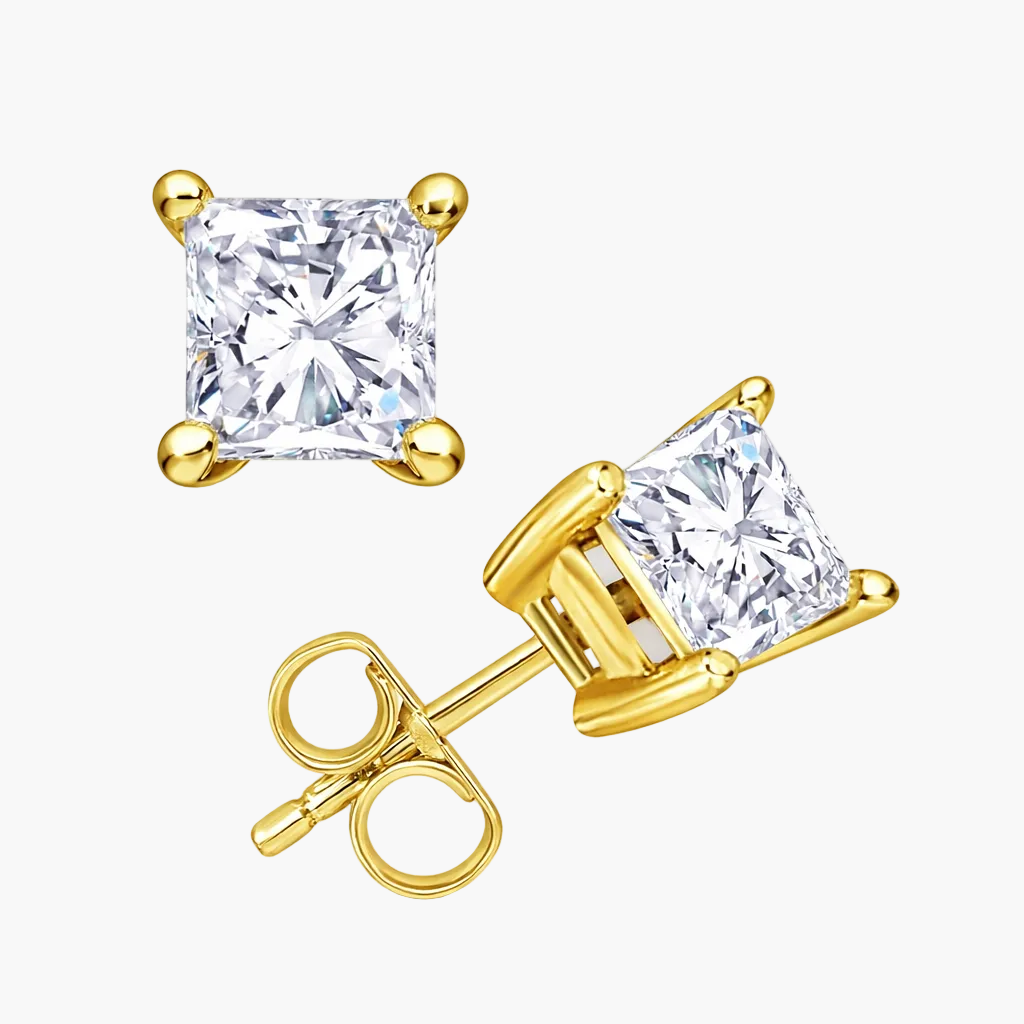 Gold stud earrings with princess cut diamonds on a white background