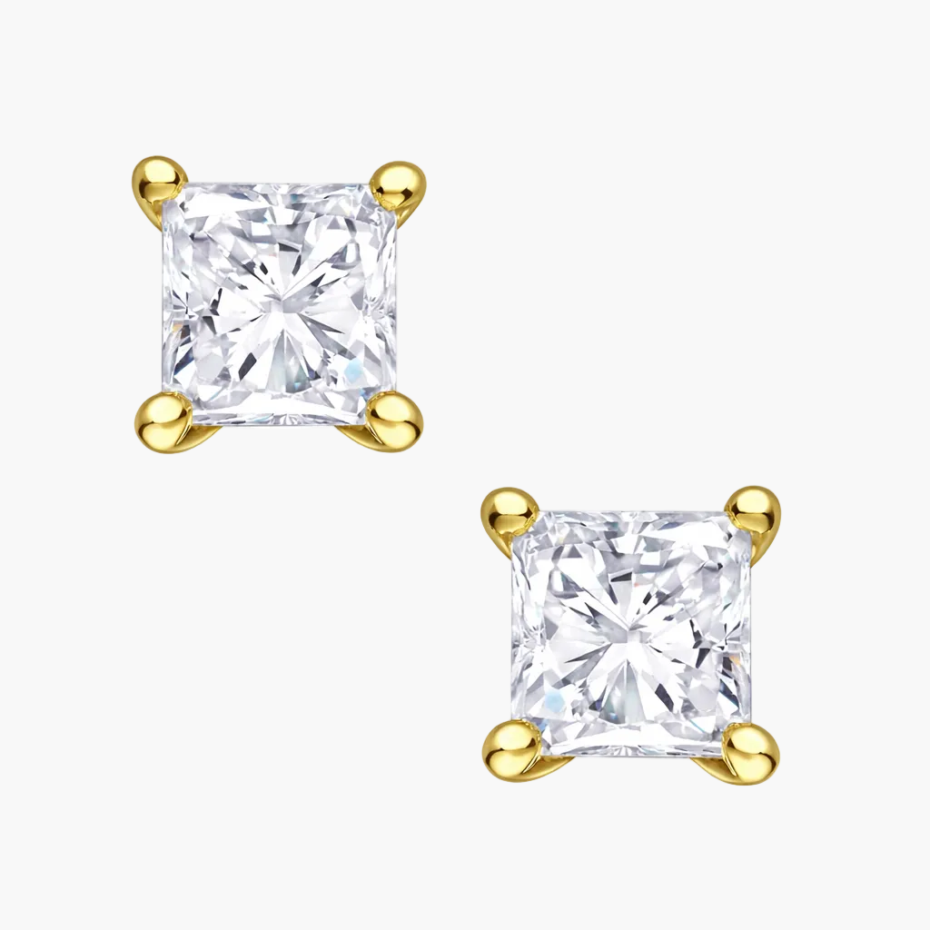 Pair of gold and diamond stud earrings on a white background