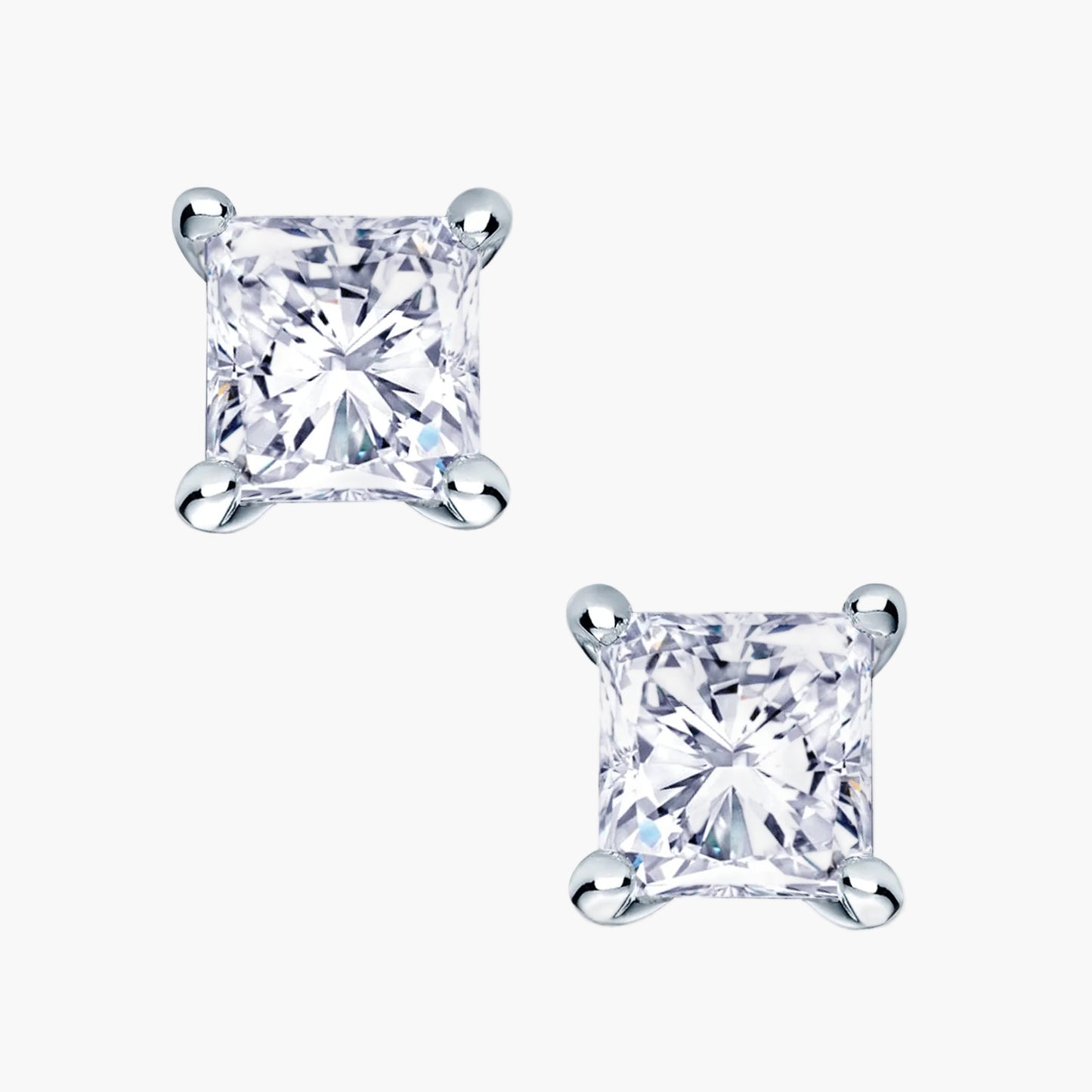 Pair of princess cut diamond stud earrings on a white background
