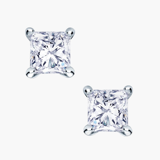 Pair of princess cut diamond stud earrings on a white background