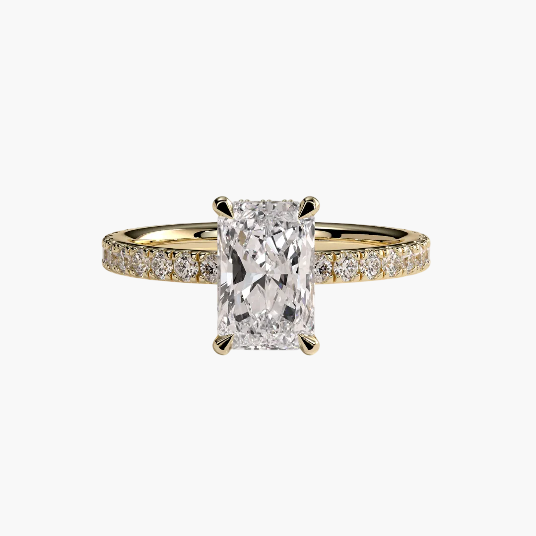 Gold ring with a large diamond and smaller diamonds on the band against a white background