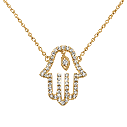 A gold Hamsa hand pendant necklace adorned with small clear stones, suspended from a matching gold chain on a plain white background.