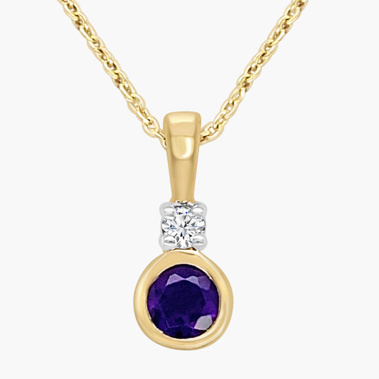 Gold pendant with purple gemstone and diamond on a white background