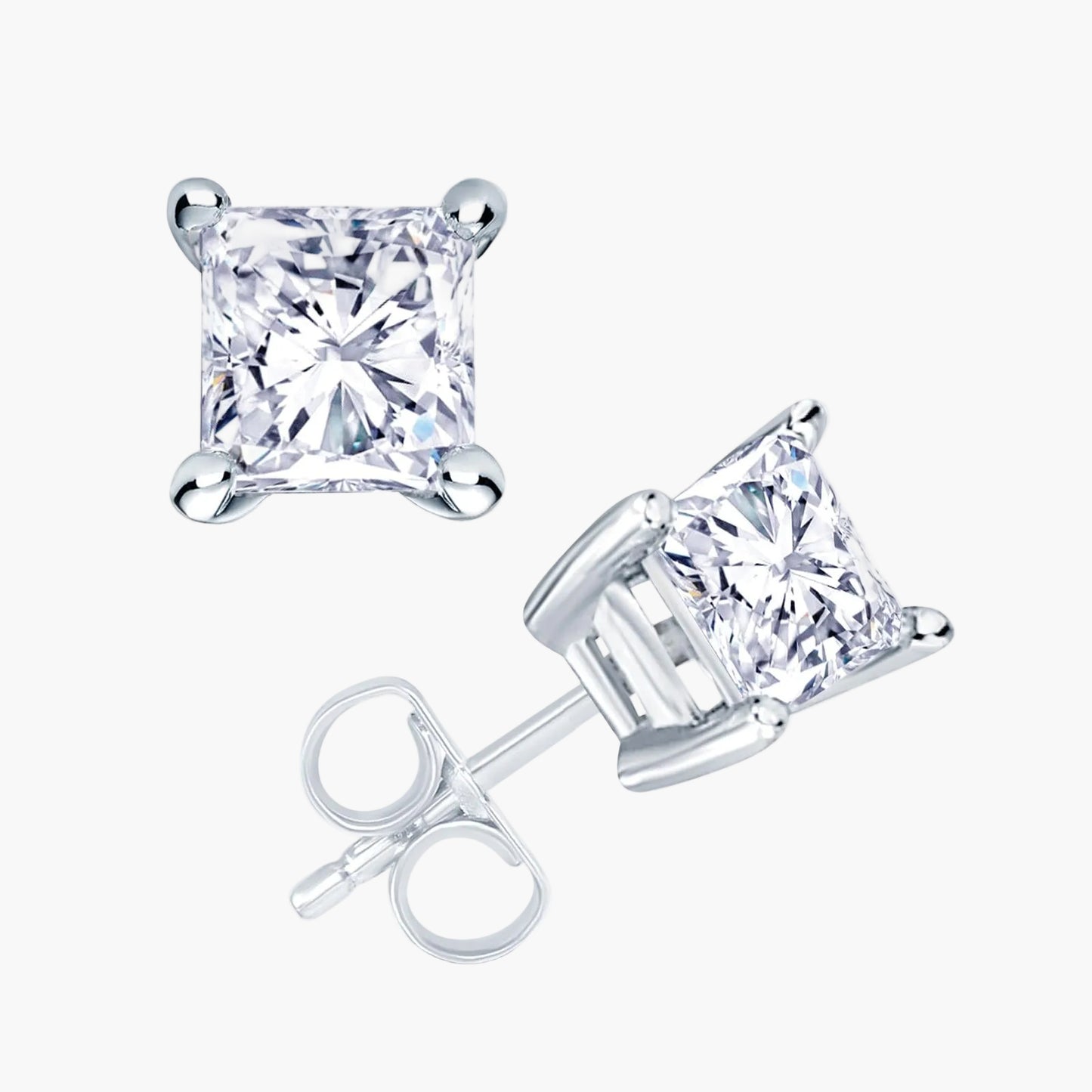 Pair of princess diamond stud earrings on a white background