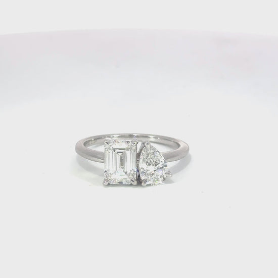 Toi et Moi Pear & Emerald-Cut and Pear Lab-Grown Diamond Engagement Ring in 18ct White Gold – A timeless and elegant design symbolizing unity, featuring a pear and emerald-cut diamond set side by side in a high-polish white gold band.