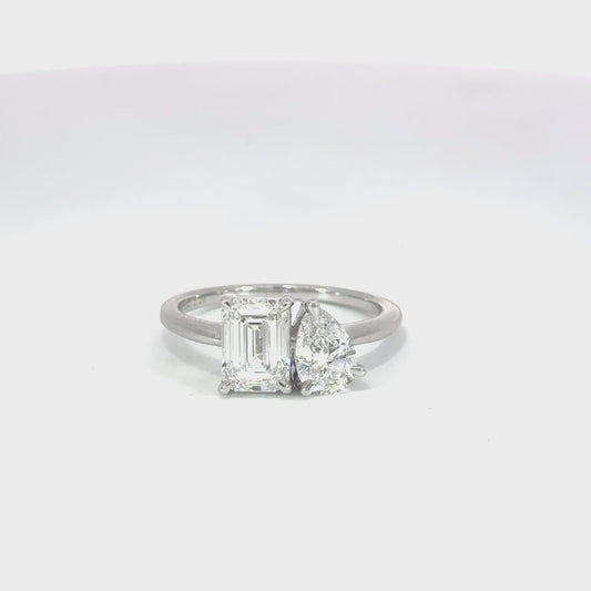 Toi et Moi Pear & Emerald-Cut and Pear Lab-Grown Diamond Engagement Ring in 18ct White Gold – A timeless and elegant design symbolizing unity, featuring a pear and emerald-cut diamond set side by side in a high-polish white gold band.