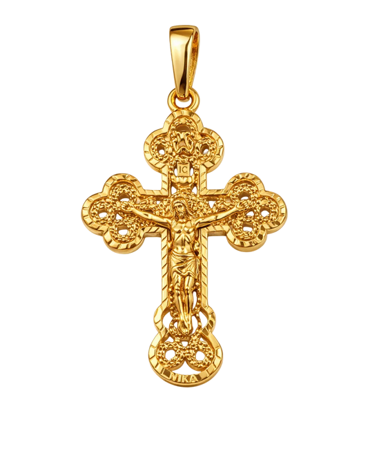 Gold crucifix pendant on a white background